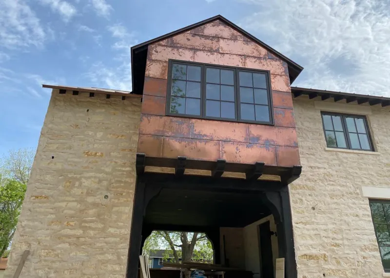 Copper metal panel facade on a stone building for Roof Repair in Lodi